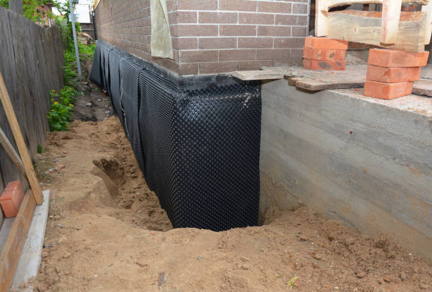 Happy homeowners after waterproofing job in Maumee